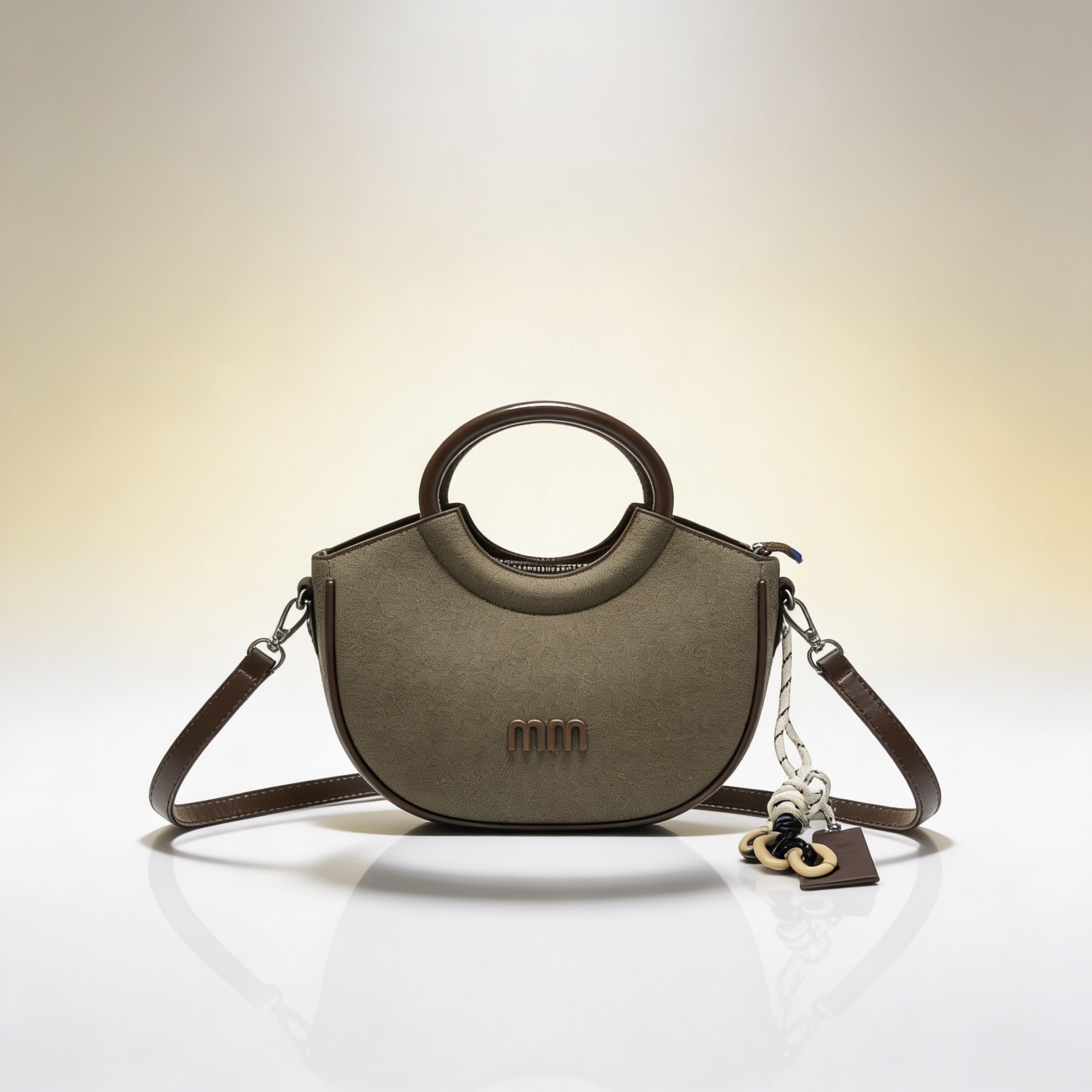 Luxury olive green canvas half-moon handbag with circular leather handles and detachable crossbody strap for women